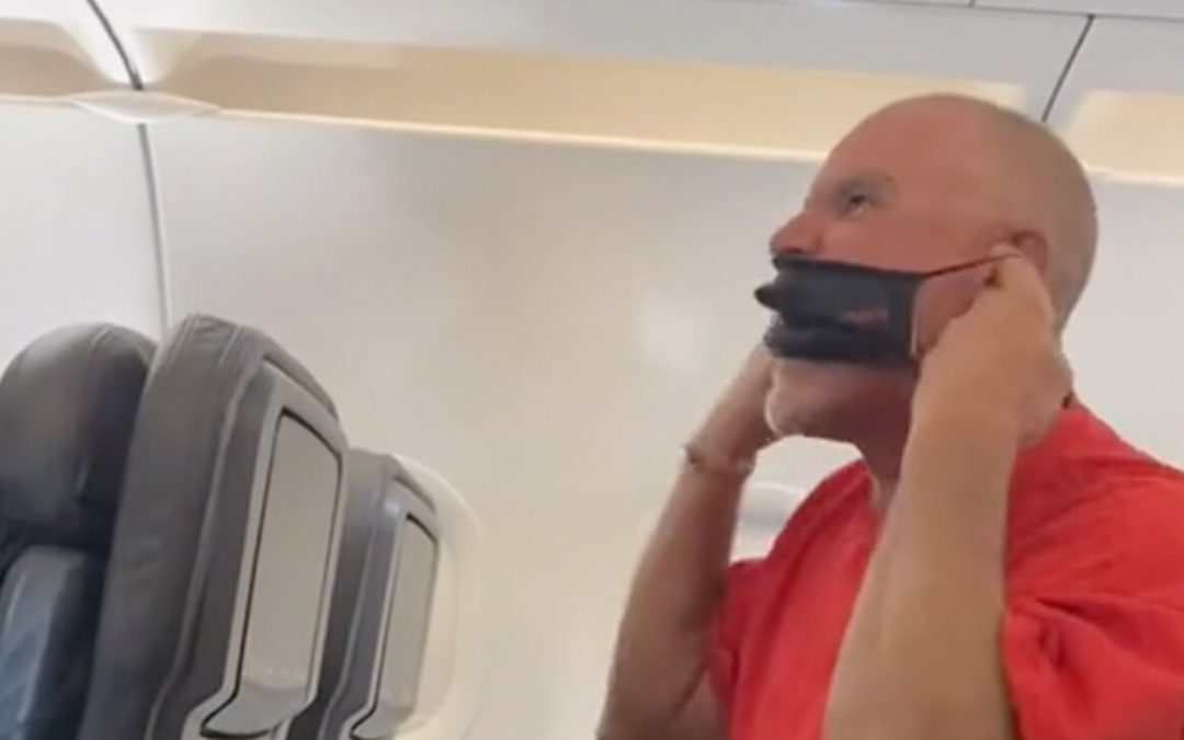 VIDEO: Passenger Screams at Flight Crews, Chews Mask, Gets Arrested
