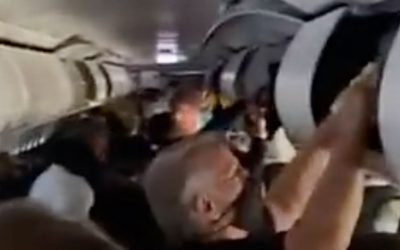 WATCH: Passengers Delay Evacuation to Collect Personal Items From Overhead Bins